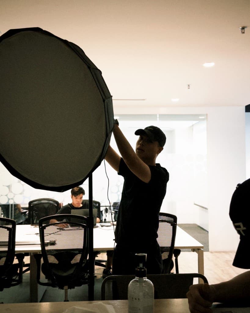 PersonEdge team setting up studio lighting